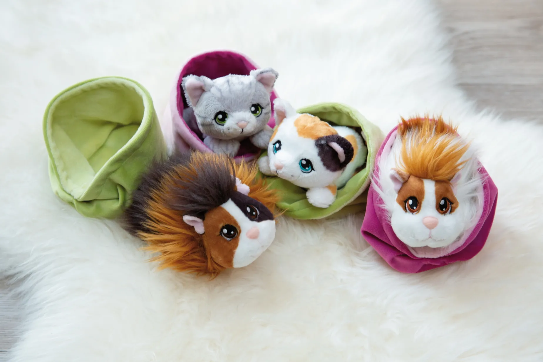 Caramell-white soft toy guinea pig in basket