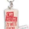 Keyholder mini plush cushion "Komm, lass uns zu weit gehen!" w. bell