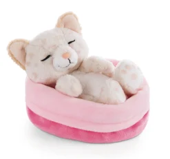 Soft toy kitty with leopard print sleeping in basket