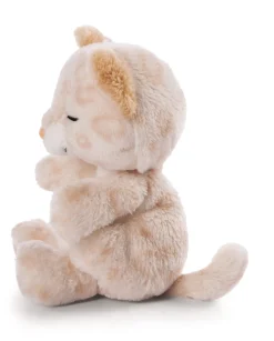 Soft toy kitty with leopard print sleeping in basket