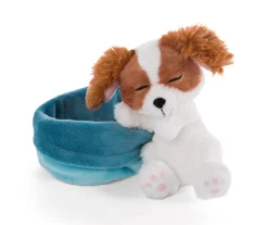 Soft toy puppy cocker spaniel sleeping in basket