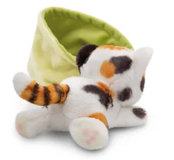 Spotted soft toy cat in basket